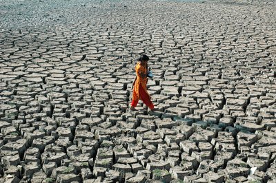 A Young Girl and Her Sister from the Below Poverty Level Group, at the Dried Up River Bed of Buriganga, in Hazaribagh, Dhaka, Bangladesh. March 4, 2005. by Unbekannt Unbekannt